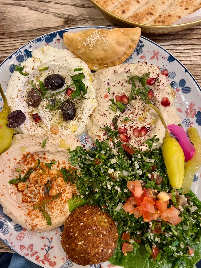 A mezze platter with hummus, baba ghanouj, tabbouleh and falafel at Mirage Mediterranean in Louisville
